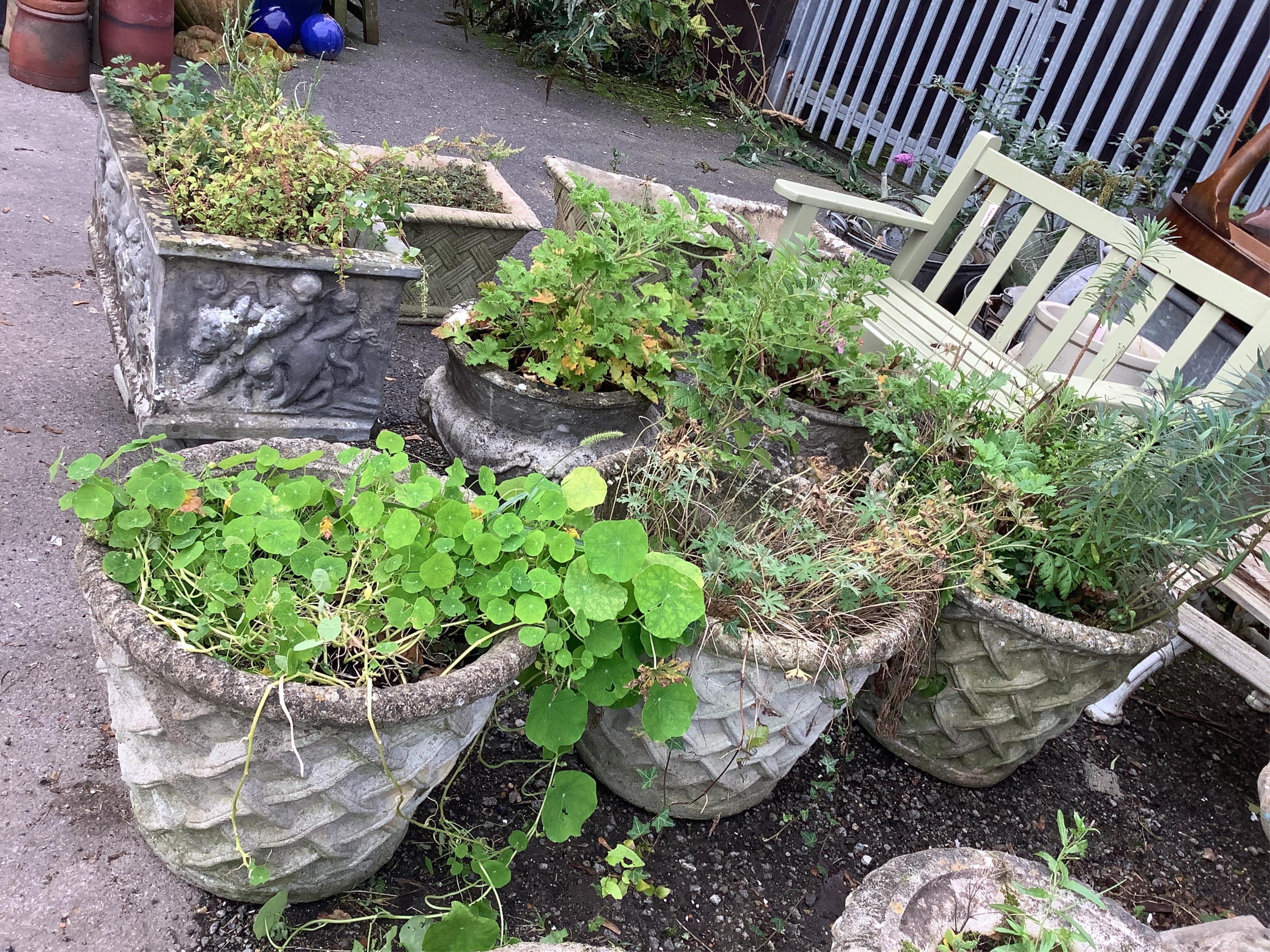 A set of three circular reconstituted stone garden planters, lattice work decoration to sides, diameter 58cm, height 44cm. Condition - fair